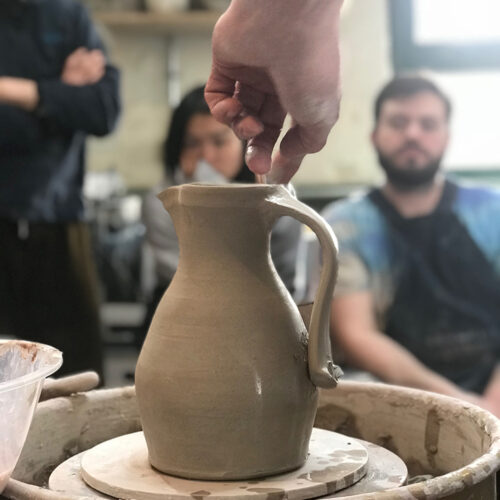 Jug with hand